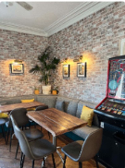 The residents' bar with dark wood counter and warm lighting